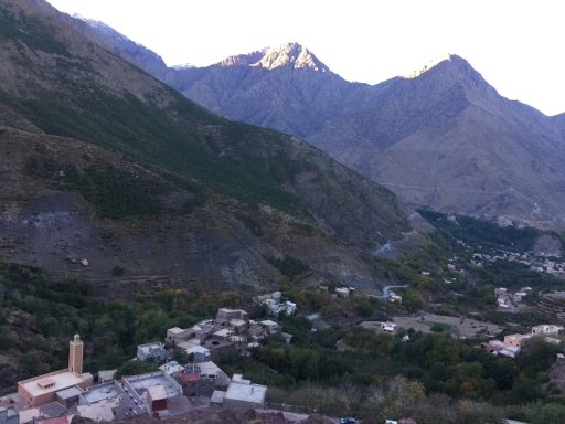 Mountainous landscape with a village nestled in the valley below.