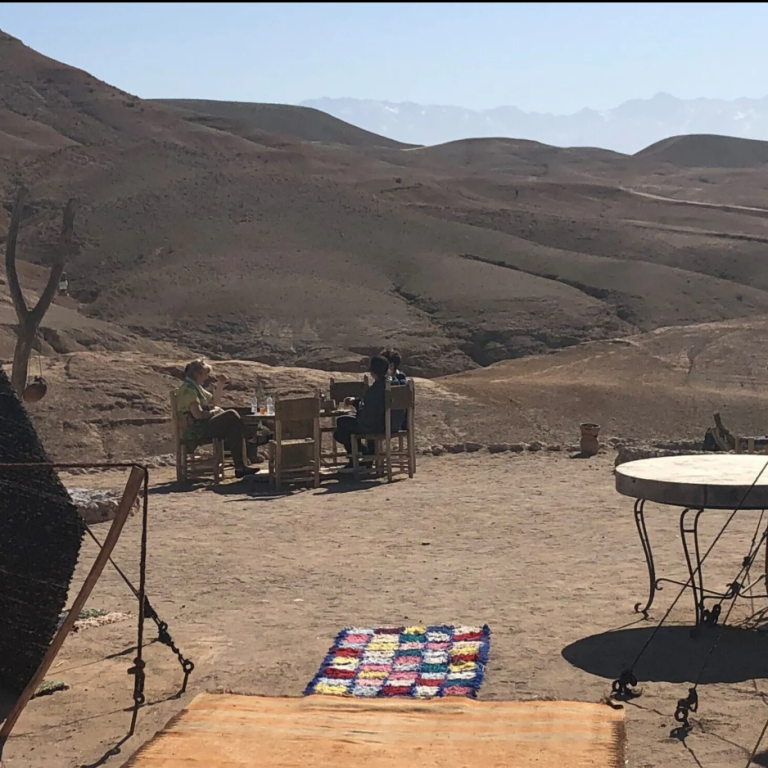 Silhouetted palm trees against a misty sunset sky.